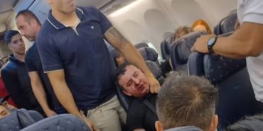 Terror in the Air! Passenger Tries to Open Plane Door