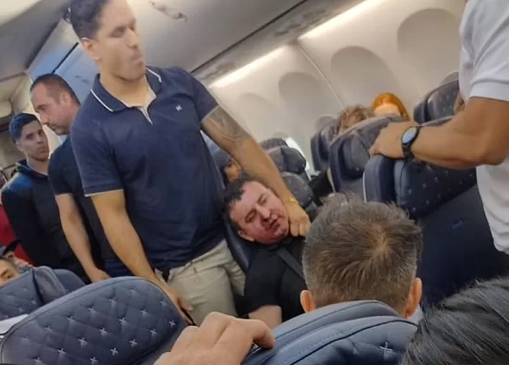 Terror in the Air! Passenger Tries to Open Plane Door