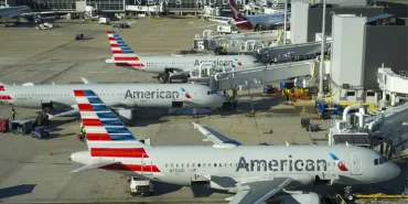 Gas alarm on American Airlines flight. 5 people taken to hospital