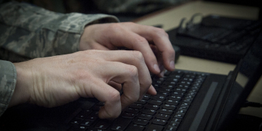 211104_airman_typing_4241135-scaled-e1636054256764