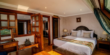 Royal-Panoramic-Suite-King-Size-Bed-Century-Cruises-1-1