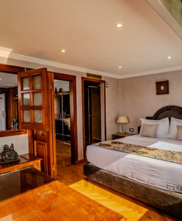 Royal-Panoramic-Suite-King-Size-Bed-Century-Cruises-1-1