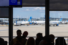 assengers-wait-in-the-boarding-area-for-a-united-airlines-flight-at-chicago-o-hare-international-airport