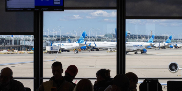 assengers-wait-in-the-boarding-area-for-a-united-airlines-flight-at-chicago-o-hare-international-airport