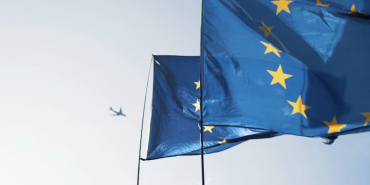 european-union-flags-waving-with-an-airplane-2026-03-16-22-33-41-utc-1