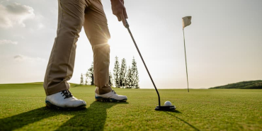 golfer-man-aiming-at-golf-ball-in-a-ready-position-2026-03-16-22-56-01-utc-1