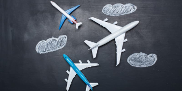 toy-airplanes-flying-in-chalk-cloud-sky-2026-01-08-22-44-25-utc-1