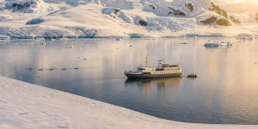 Aureum-Neko-Harbour-down-to-Andvord-Bay-with-people-kayaking-Arctowski-Peninsula-mainland-Antarctica-Secret-Atlas-1