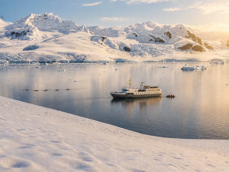Aureum-Neko-Harbour-down-to-Andvord-Bay-with-people-kayaking-Arctowski-Peninsula-mainland-Antarctica-Secret-Atlas-1