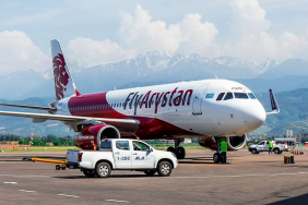 flyarystan-airbus-a320-aircraft-parked-mountains-1
