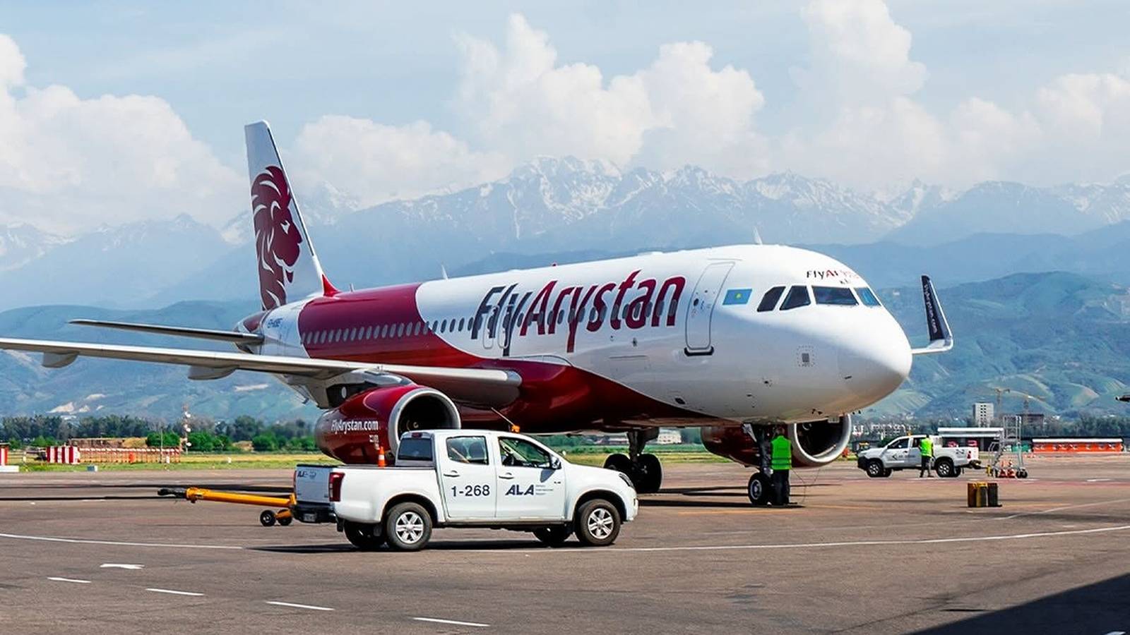 flyarystan-airbus-a320-aircraft-parked-mountains-1