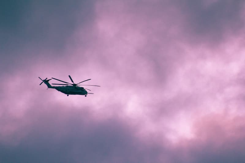 helicopter-silhouette-ascending-into-a-pink-sky-2026-03-18-05-41-51-utc-1